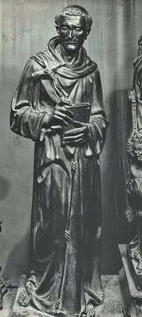 Statua in bronzo di San Francesco in piedi, con il saio e un libro in mano